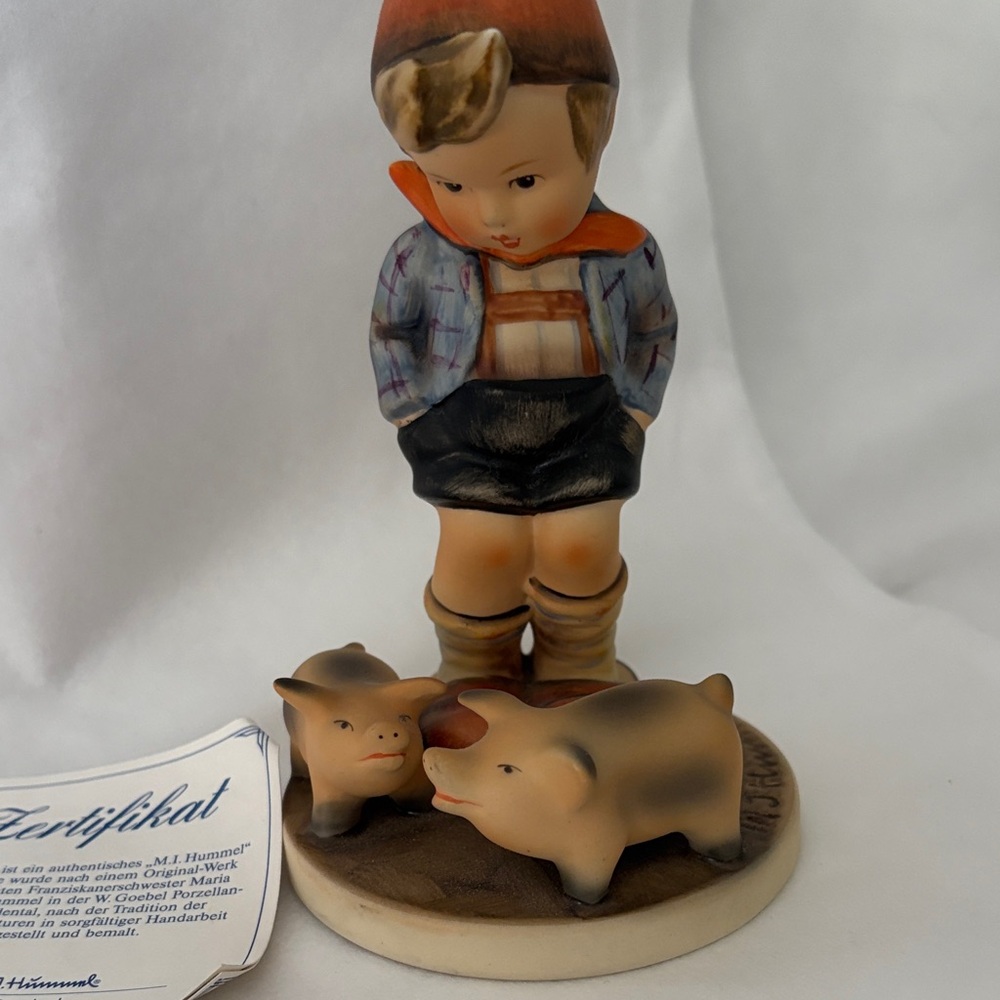 Hummel Figurine with Boy and Pigs - Blue and Brown